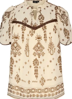 Bluse mit Muster und Häkelborte