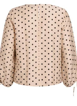 Bluse mit Punkten und Bindedetails
