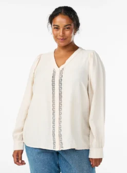Bluse mit V-Ausschnitt und bestickten Bändern