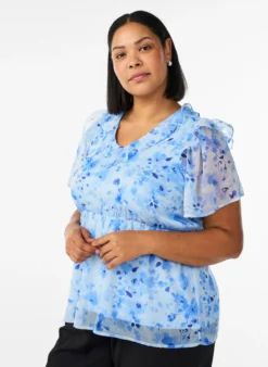 Geblümte Bluse mit Rüschenkragen und Peplum-Effekt