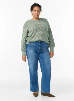 Gemusterte Strickbluse mit welligem Rand und Rundhalsausschnitt