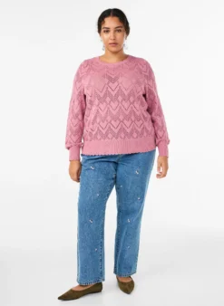 Gemusterte Strickbluse mit welligem Rand und Rundhalsausschnitt