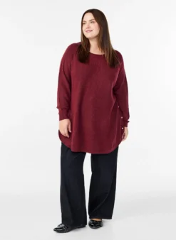 Lange Strickbluse mit Kugelknöpfen