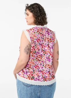 Ärmellose Bluse aus Baumwolle mit Blumenprint und Broderie Anglaise