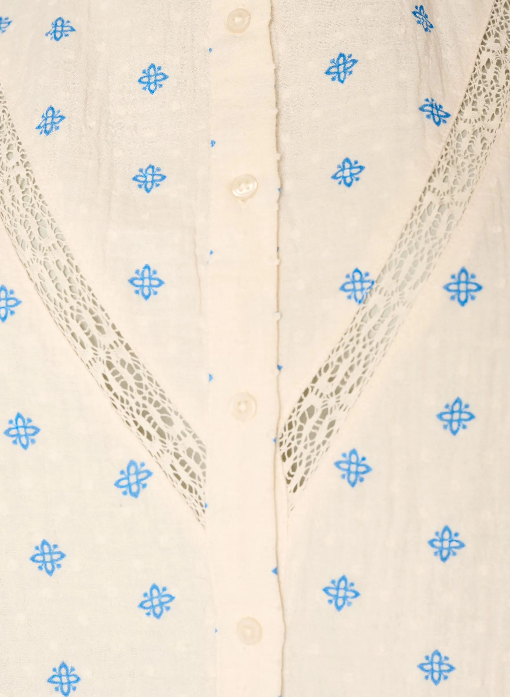 Ärmellose Bluse mit Häkelborte und Rüschendetail