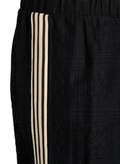 Weite Spitzenhose mit Kontraststreifen